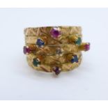 An Indian high carat gold gem set ring, foreign marks to back of shank, 3.2g, L