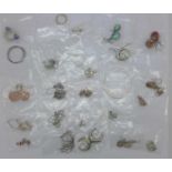 Twenty-five pairs of silver earrings