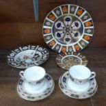 A Royal Crown Derby 1128 pattern plate and side plate and a Royal Crown Derby 2451 pattern bowl, all