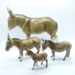 A Sylvac model of a donkey and a set three Beswick graduated donkeys, two a/f