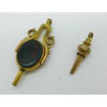 Two gilt metal pocket watch keys, one with swivel action and set with hardstone