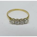 An 18ct gold platinum diamond four stone ring, 1.6g, P