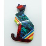 An Art Deco style lucite cat brooch