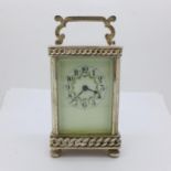 A silver plated carriage clock, with key