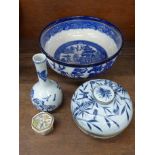 A Booths willow pattern bowl, an oriental blue and white vase, lidded pot and trinket box