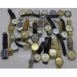 A collection of wristwatches including Sekonda, Ruhla, Ricoh, Titus, etc.
