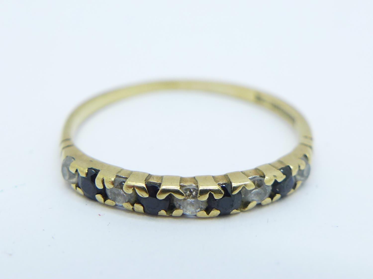 A 9ct gold ring with small sapphire and diamonds, 0.8g, M