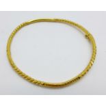 A yellow metal bangle marked 916, (22ct), 13.1g