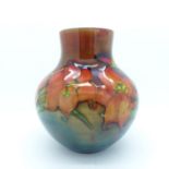 An early 20th century Moorcroft freesia pattern vase, rim a/f, restored chip and cracked, 12cm