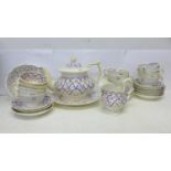A French twelve setting tea set, with teapot, cream, sugar and sandwich plate