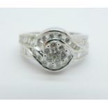 An 18ct white gold and diamond ring, 0.75 carat diamond weight, marked on the shank, 6.1g, M