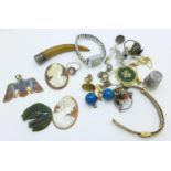 A lady's wristwatch, thimble, cameos, etc.