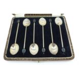 A cased set of six silver coffee bean spoons, 42g