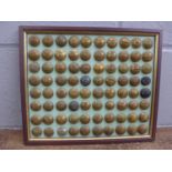 A framed set of military buttons , 80 in total