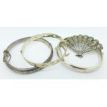 Three silver bangles and a silver and marcasite fan shaped brooch, 51g