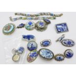 A collection of jewellery including Delft and two enamel panel bracelets decorated with flowers