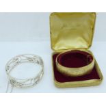 A 925 silver bangle, 35g and a rolled gold bangle