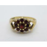A 9ct gold and garnet ring, 2.8g, P