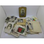 A collection of black and white photographs and vintage letters, etc.