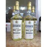 Four bottles of vintage Booth's finest dry gin