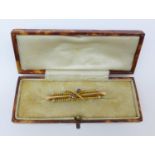 A 15ct gold and sapphire brooch, 2.9g, boxed