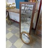 A pine framed mirror and a circular gilt mirror