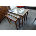 A Danish teak and tiled top nest of tables