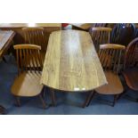 A Formica drop-leaf kitchen table and four chairs