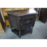 A 17th Century style oak barleytwist credence cupboard