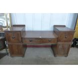 A Regency inlaid mahogany breakfront serving table