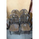 A set of four beech wheelback kitchen chairs