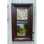 A 19th Century American Chauncey Jerome, New Haven mahogany 8-day ogee wall clock