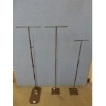 Three steel haberdashery shop stands