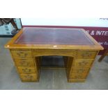 A Victorian oak kneehole desk