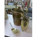 A brass coal scuttle and companion set