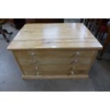 A pine four drawer plan chest