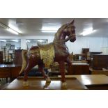 An oriental painted carved wood stallion