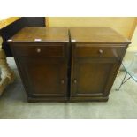 A pair of oak pot cupboards