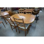 A Danish teak dining table and four chairs