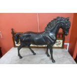 A large bronze figure of a stallion