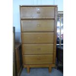 A mid 20th century Staverton oak fitted five door cabinet