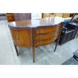 A George IV style mahogany serpentine sideboard