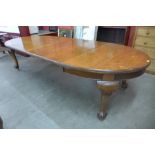 A Victorian oak extending dining table