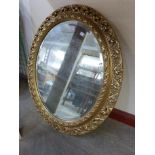 A gilt framed circular bevelled mirror