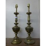 A pair of French style gilt metal table lamp bases