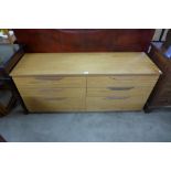 A teak chest of drawers