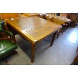 An oak draw-leaf table