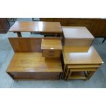 A teak telephone seat, nest of tables, side table and a chest of drawers