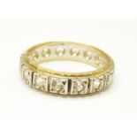 A 9ct gold and silver white stone set eternity ring, O