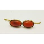 A pair of yellow metal set coral earrings, (tests as high carat gold)